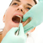 A dentist performing an emergency tooth extraction